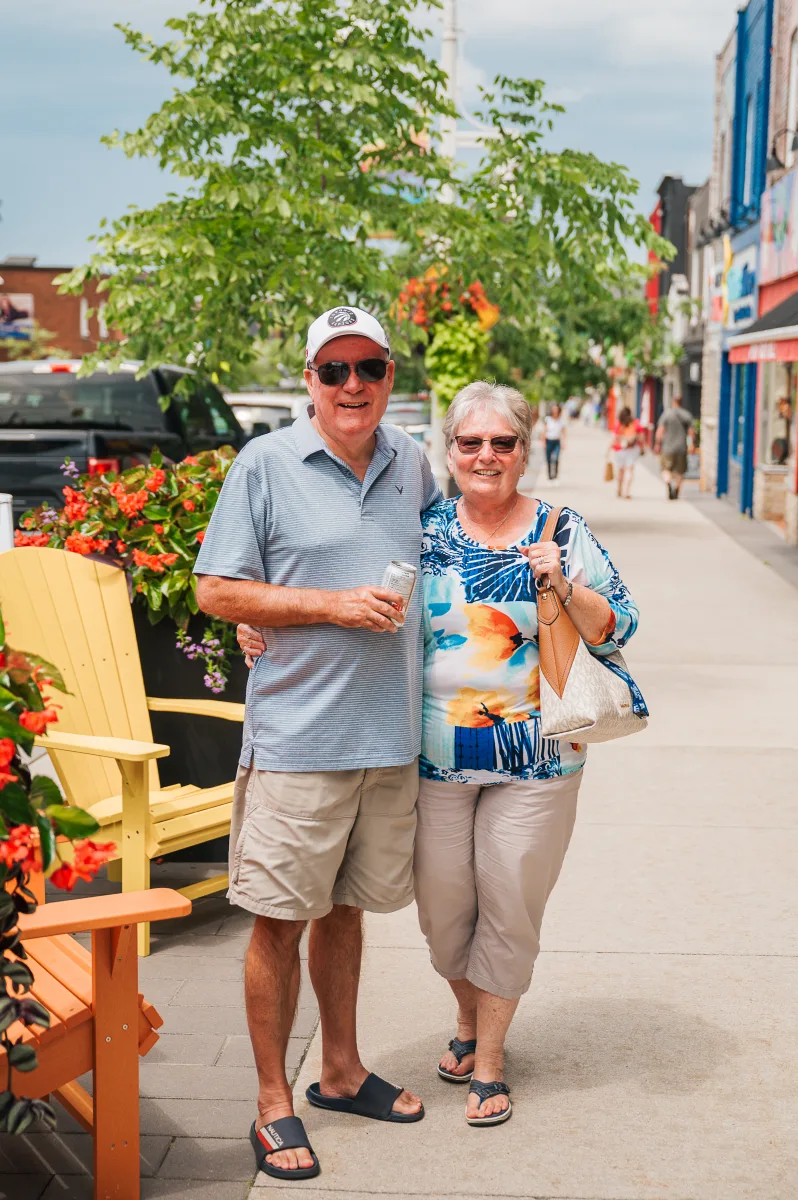 Couple Enjoying King Street in the summer beside patio seating