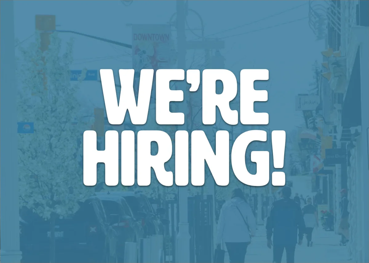 The words We're Hiring on a blue background